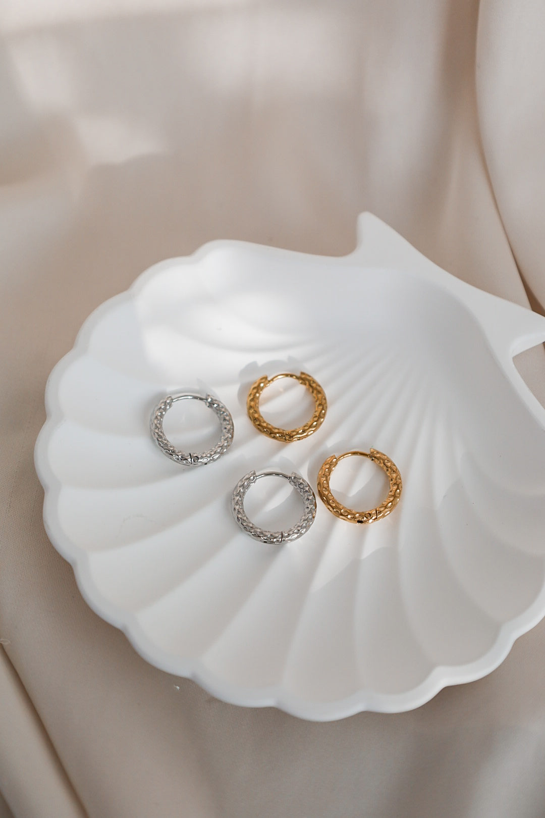 Korvakorurengas, vedenkestävä